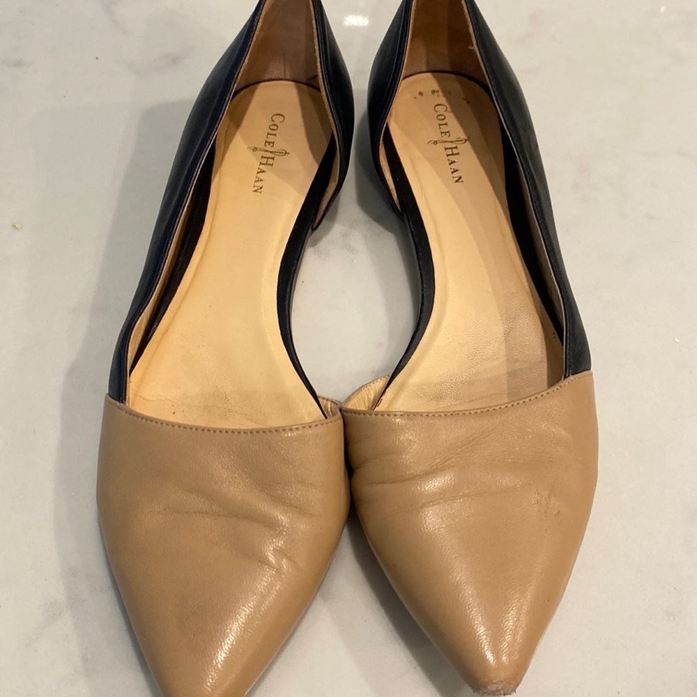Tan and Black Cole Haan flats. Good condition. Size 9
